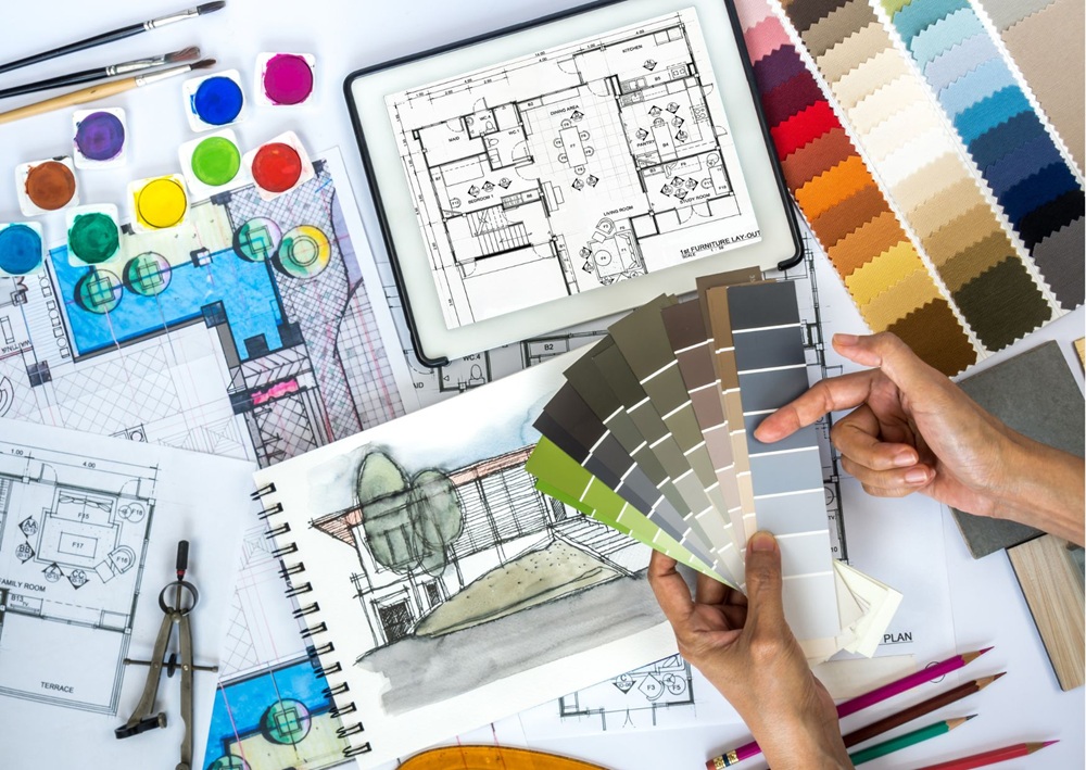 Interior design plans, floor layouts, color swatches, and material samples arranged for professional consultation.
